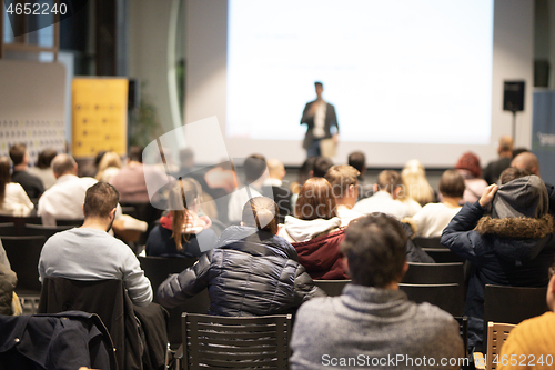 Image of Business speaker giving a talk at business conference event.