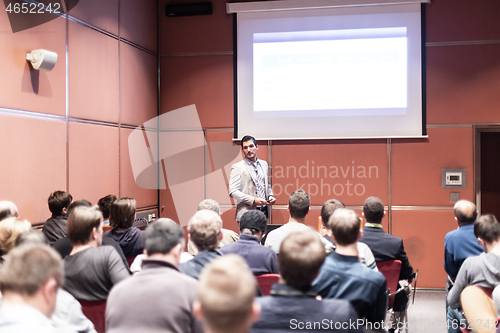 Image of Business speaker giving a talk at business conference meeting event.