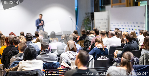 Image of Business speaker giving a talk at business conference event.