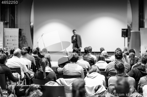 Image of Business speaker giving a talk at business conference event.