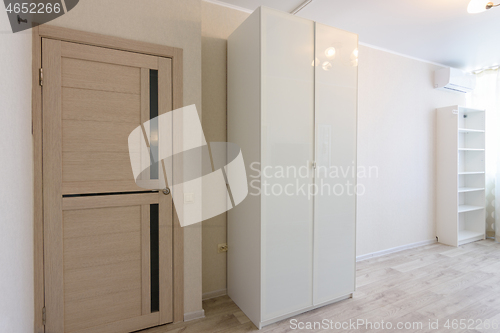 Image of Fragment of the interior of the bedroom, entrance door and wardrobes