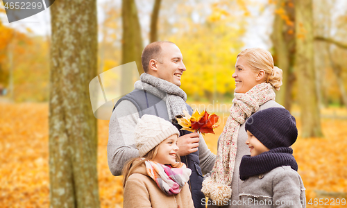 Image of happy family in autumn park