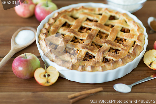 Image of close up of apple pie on wooden table