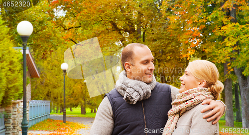 Image of smiling couple in autumn park