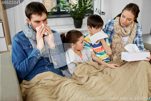 Image of ill family with children having flu at home