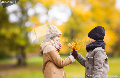 Image of smiling children in autumn park