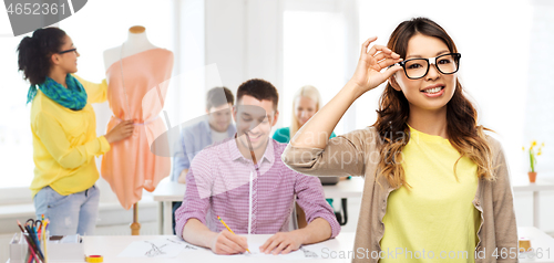 Image of happy asian woman in glasses or student