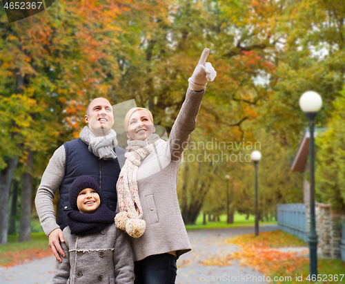 Image of happy family in autumn park