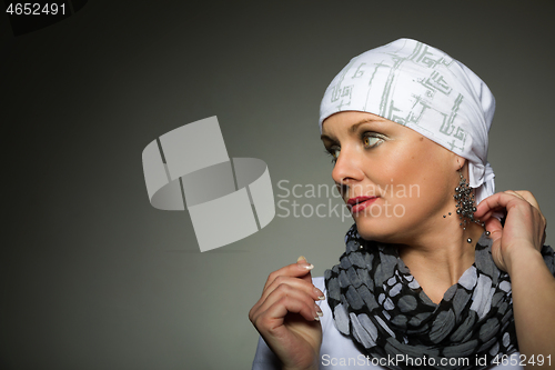 Image of beautiful middle age woman cancer patient wearing headscarf