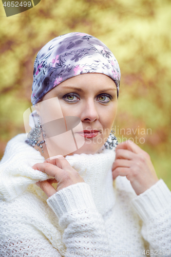 Image of beautiful middle age woman cancer patient wearing headscarf