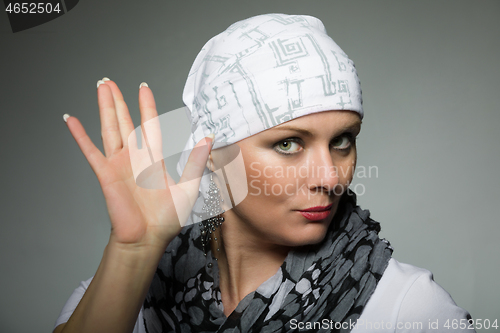 Image of beautiful middle age woman cancer patient wearing headscarf