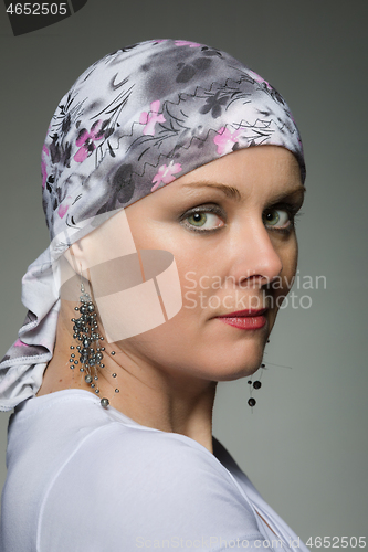 Image of beautiful middle age woman cancer patient wearing headscarf