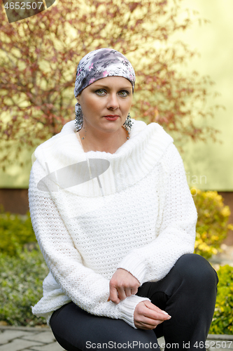 Image of beautiful middle age woman cancer patient wearing headscarf