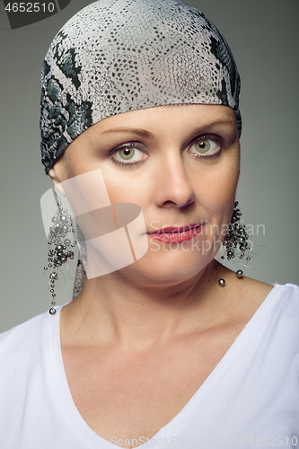 Image of beautiful middle age woman cancer patient wearing headscarf