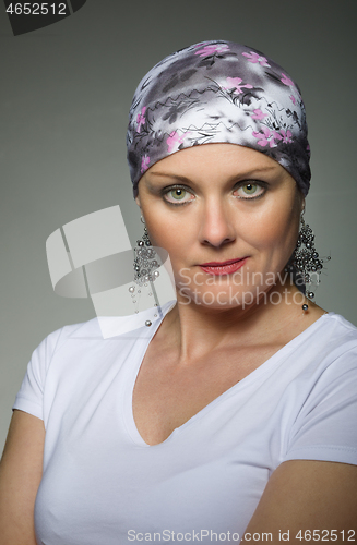 Image of beautiful middle age woman cancer patient wearing headscarf