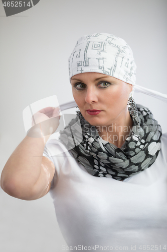 Image of beautiful middle age woman cancer patient wearing headscarf