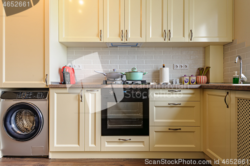 Image of modern cream colored kitchen interior