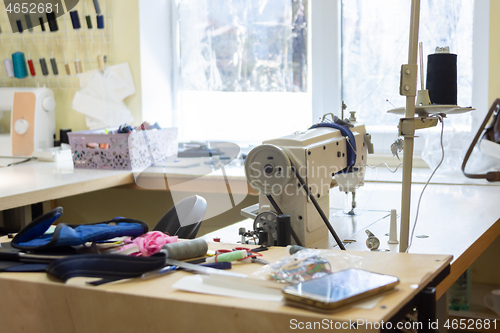 Image of seamstresses in workshop with industrial sewing equipment