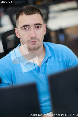 Image of casual business man working on desktop computer