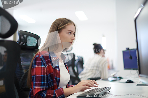 Image of casual business woman working on desktop computer