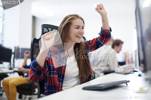 Image of casual business woman celebrating success