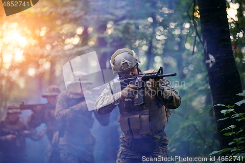 Image of Modern warfare Soldiers  Squad  in battle