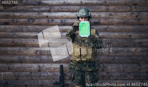 Image of woman soldier using tablet computer