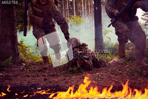 Image of Modern warfare Soldiers  Squad  in battle