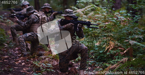 Image of Modern warfare Soldiers  Squad  in battle