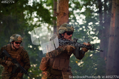 Image of Modern warfare Soldiers  Squad  in battle