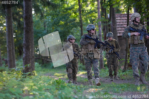 Image of Modern warfare Soldiers  Squad  in battle