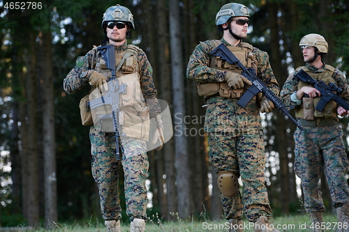 Image of Modern warfare Soldiers  Squad  in battle