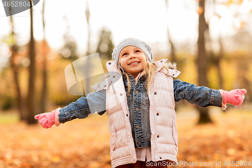 Image of happy girl at autumn park