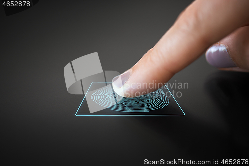 Image of finger touching black interactive panel