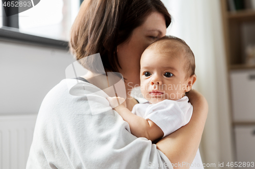 Image of close up of mother holding her baby