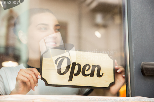 Image of Open sign on the glass of street cafe or restaurant