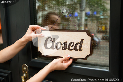 Image of Closed sign on the glass of street cafe or restaurant