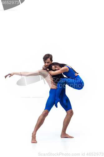 Image of The couple of modern dancers, art contemp dance, blue and white combination of emotions