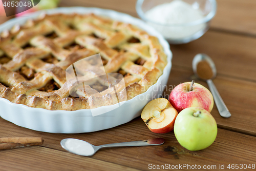 Image of close up of apple pie on wooden table