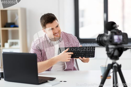 Image of male video blogger with keyboard videoblogging