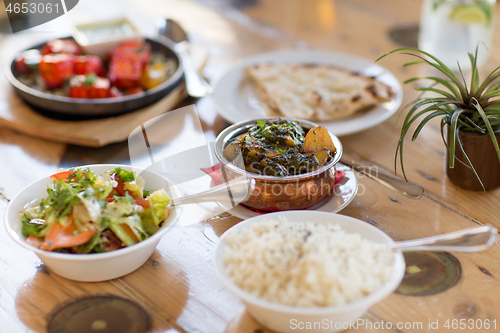 Image of close up of aloo palak dish in bowl on table