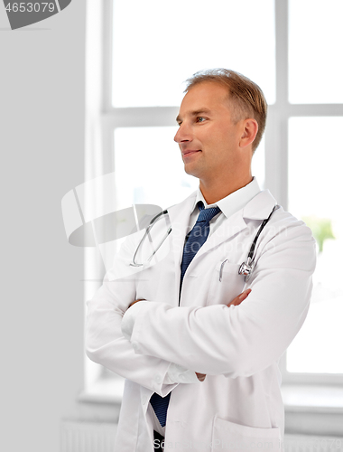 Image of smiling doctor in white coat at hospital