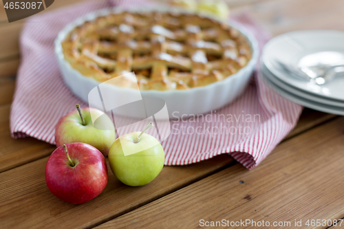 Image of apples and pie on wooden table