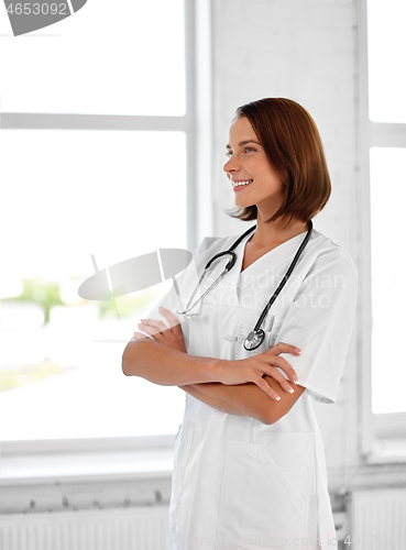 Image of smiling doctor in white coat at hospital