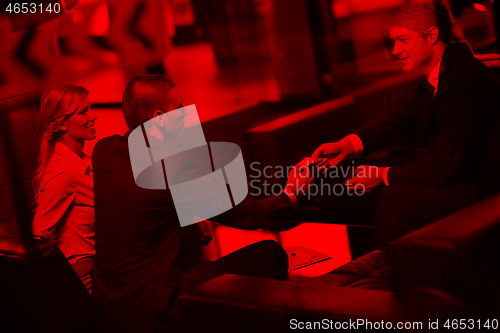 Image of business people making deal