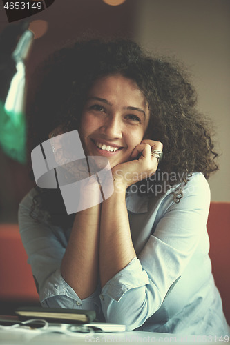 Image of young  business woman at office