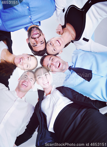 Image of business people with their heads together