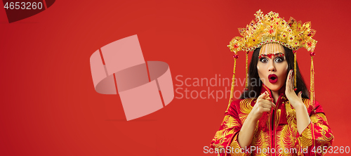 Image of Chinese traditional woman. Beautiful young girl wearing in national costume