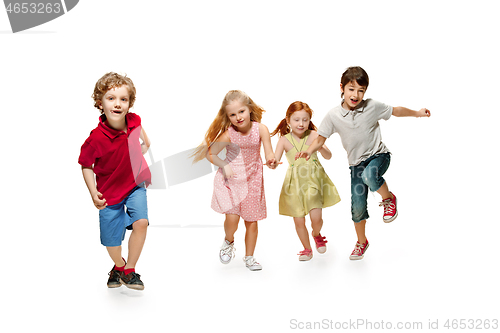 Image of Group of fashion cute preschooler kids friends running together