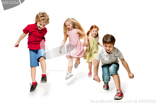 Image of Group of fashion cute preschooler kids friends running together